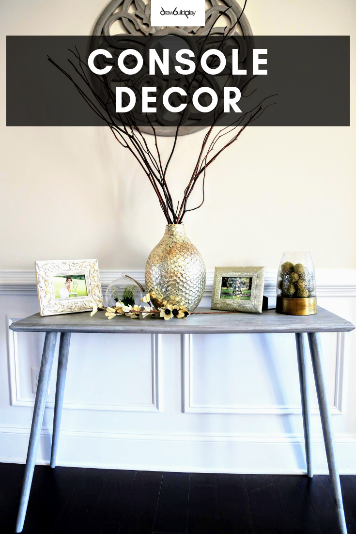 Console decor for your entryway table or hallway.  This console table is slim so it doesn't take up much space, making it perfect for a hallway or entryway location. Decorate your console with elements of gold to compliment the gray whitewash, giving you a modern console decor on a beautiful rustic farmhouse console table. #farmhouse #farmhousetable #rusticfarmhousetable #entryway #hallwaytable #consoledecor #decorentryway