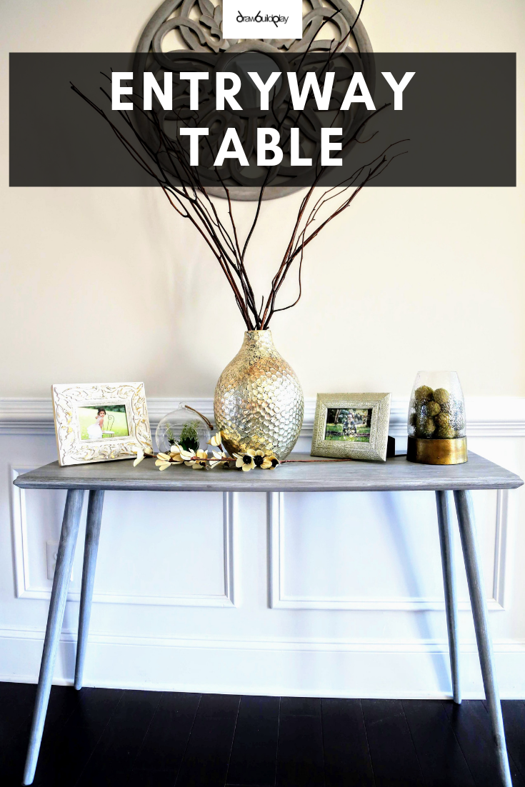 Entryway Table with the farmhouse look, for your entryway or hallway.  This modern farmhouse table is slender so it doesn't take up too much space, making it a perfect table for your hallway or entryway location.  The grey whitewash makes it a must have decor piece in your farmhouse home. #farmhouse #farmhousetable #rusticfarmhousetable #entryway #hallwaytable #consoledecor #decorentryway