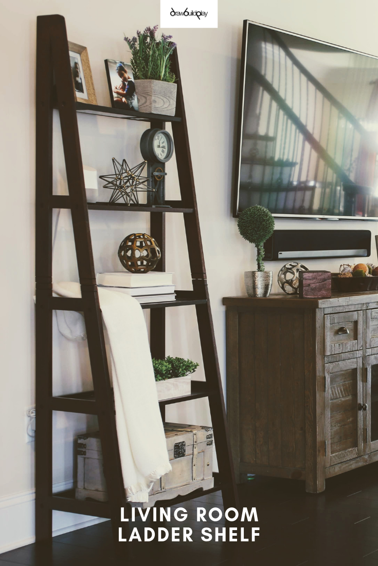 This living room ladder shelf is a great way to add to your farmhouse style in your living room.  This works with any wooden ladder in a living room.  Then dress up your living room ladder shelf with some ladder decor, books, and greenery to make the ladder the centerpiece in your living room.  #livingroom #farmhouse #laddershelf #farmhouseshelf #farmhousedecor #beautifulfamilyroom #decor #homedecor #familyroomdecor